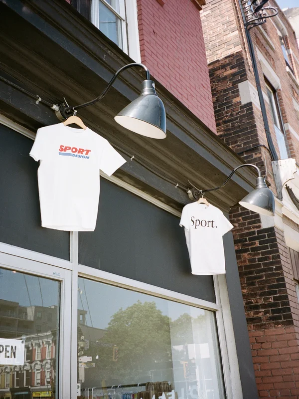 photo of t shirts hanging outside store.